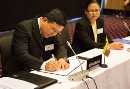 Pwint San, Deputy Minister of Commerce, Myanmar (left), signing the Joint Declaration on Cooperation; and Naw Mutakapaw, Director, Ministry of Commerce, Myanmar.